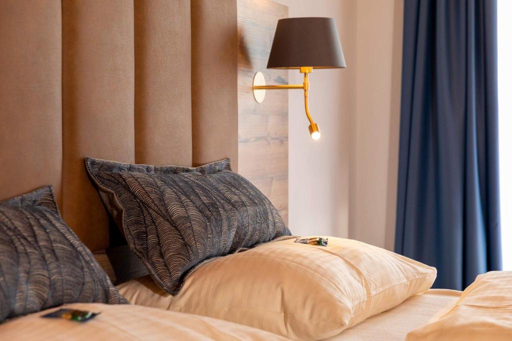 Postel nebo postele na pokoji v ubytování Berg Hotel Weingarten Garni