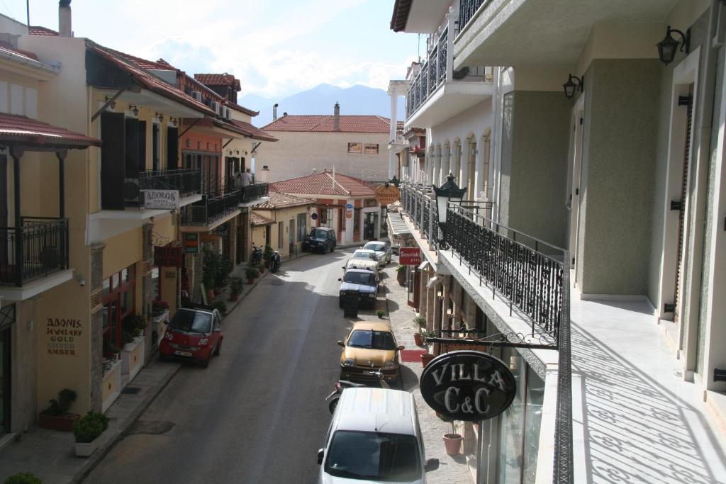 a city street with cars parked on the side of a building at Villa C & C in Delphi