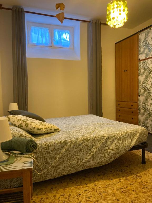 a bedroom with a bed and a window at Casa Le Felci in Florence