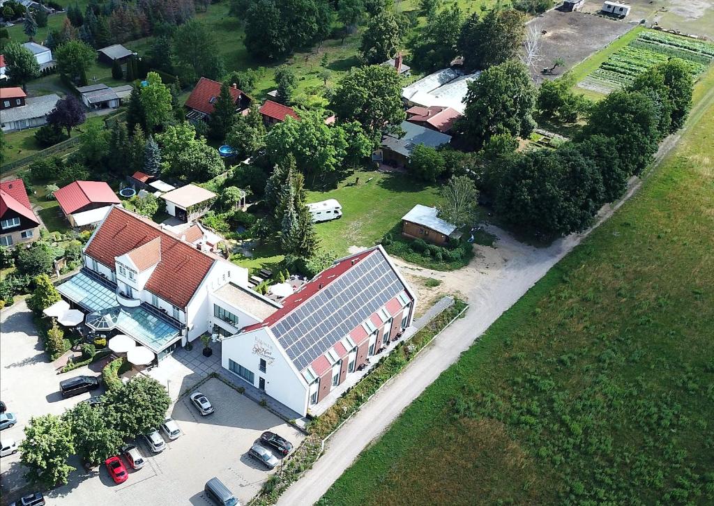 an aerial view of a house with a solar roof at Flair Hotel Reuner in Zossen