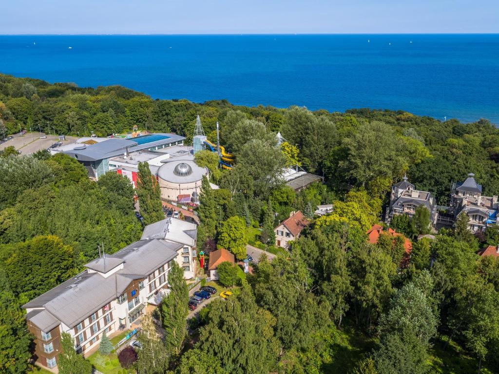 an aerial view of a town with trees and the ocean at Hotel Aqua Sopot - Destigo Hotels in Sopot