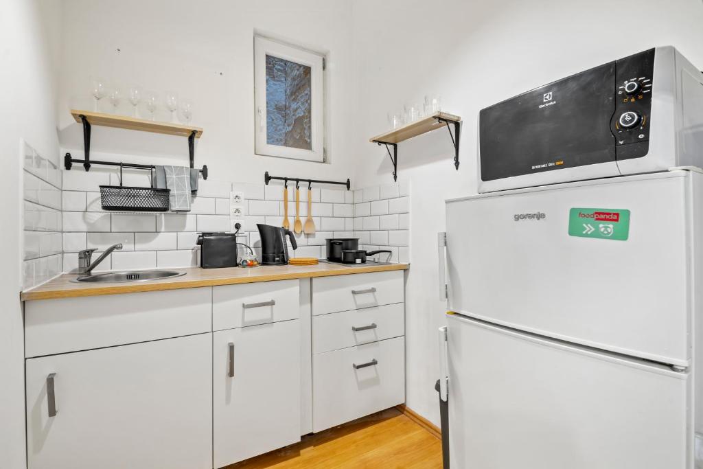 Kuchyňa alebo kuchynka v ubytovaní Venus Apartments - Akacfa II