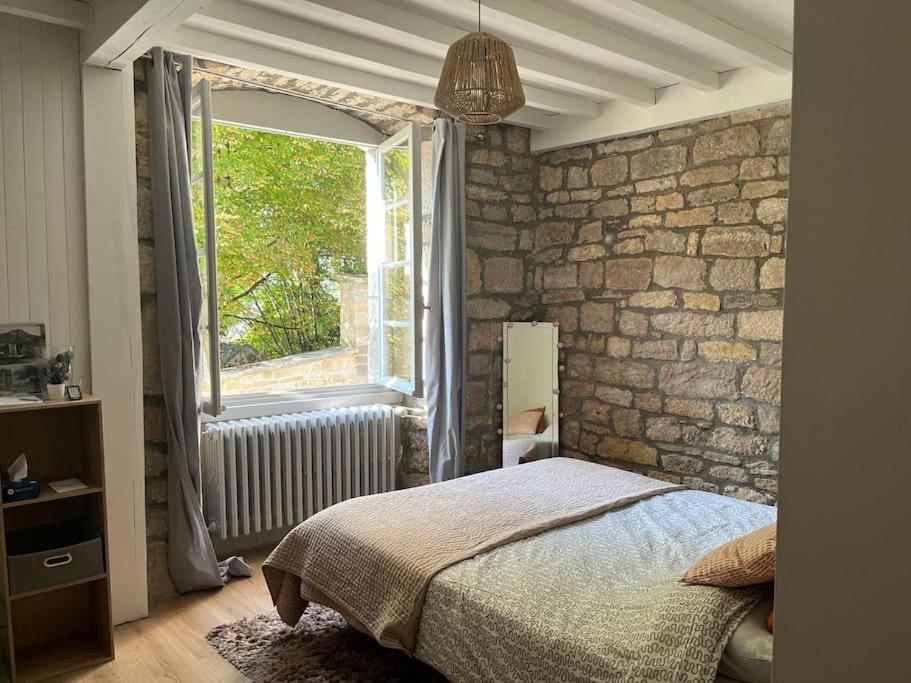 En eller flere senge i et værelse på Salins-les Bains : A l'ombre de La Tour Carrée