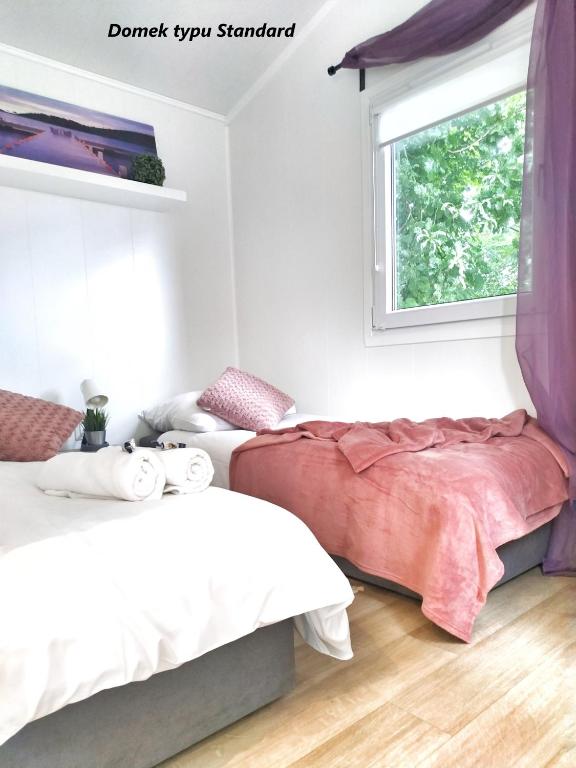 Posteľ alebo postele v izbe v ubytovaní LUXURY CAMP - 150 m od Suntago Park