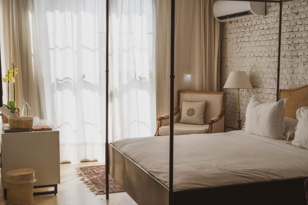 Postel nebo postele na pokoji v ubytování Casa Del Val - Villa María Hotel