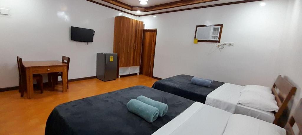 Postel nebo postele na pokoji v ubytování Takbo Beach Resort