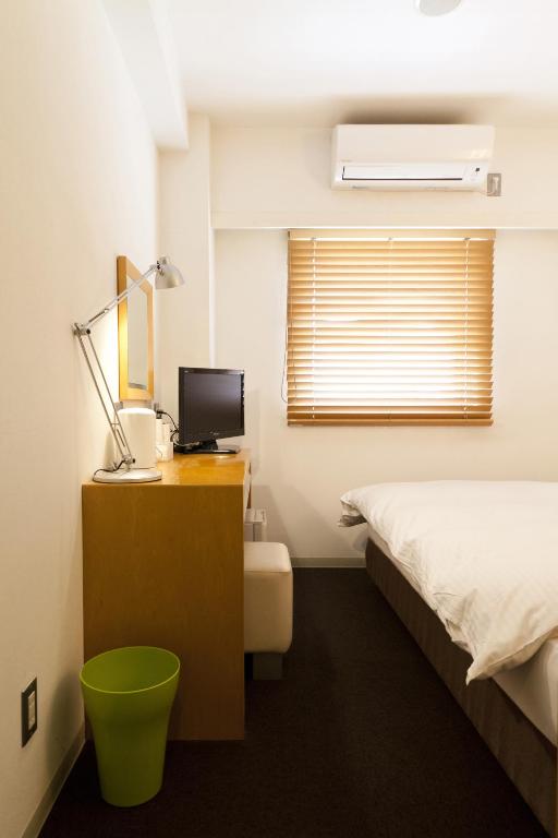Postel nebo postele na pokoji v ubytování 7 Days Hotel