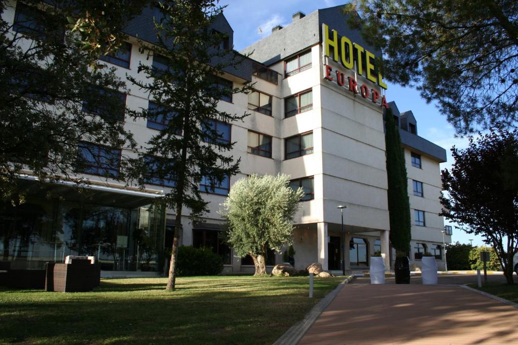 a hotel with a sign on the front of it at Hospedium Hotel Europa Centro in Magaz De Pisuerga
