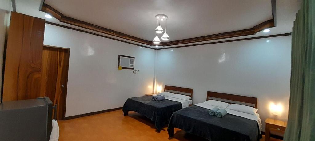 Postel nebo postele na pokoji v ubytování Takbo Beach Resort