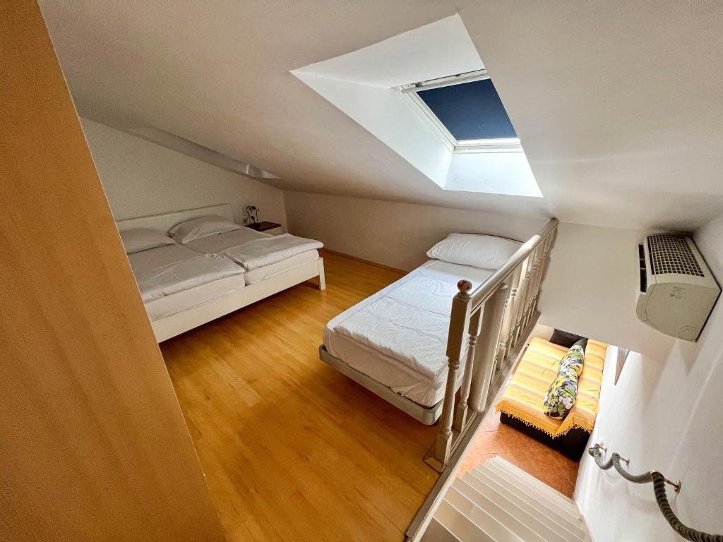 Postel nebo postele na pokoji v ubytování Apartments Arena
