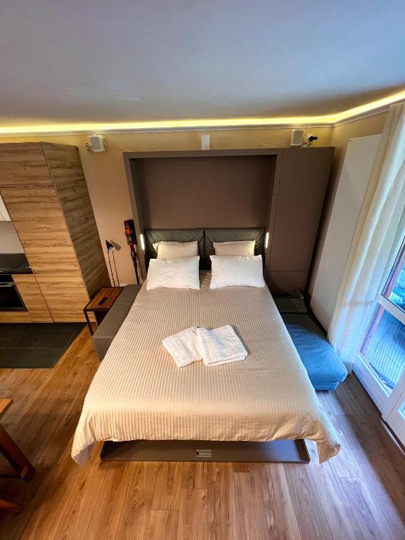Postel nebo postele na pokoji v ubytování La Baita Limone Riserva Bianca Ski-in Ski-out Seggiovia Morel 1