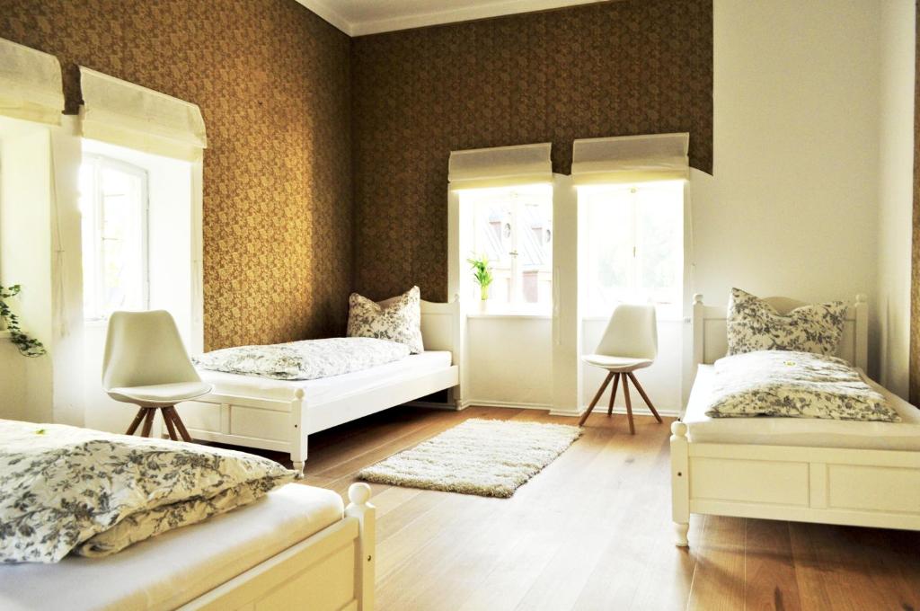 Postel nebo postele na pokoji v ubytování Art Hotel & Hostel