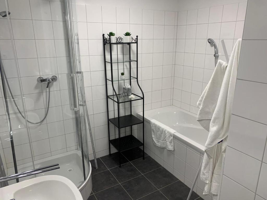 a bathroom with a shower and a toilet and a sink at Obertauern Fewo Top 12 by Kamper in Obertauern