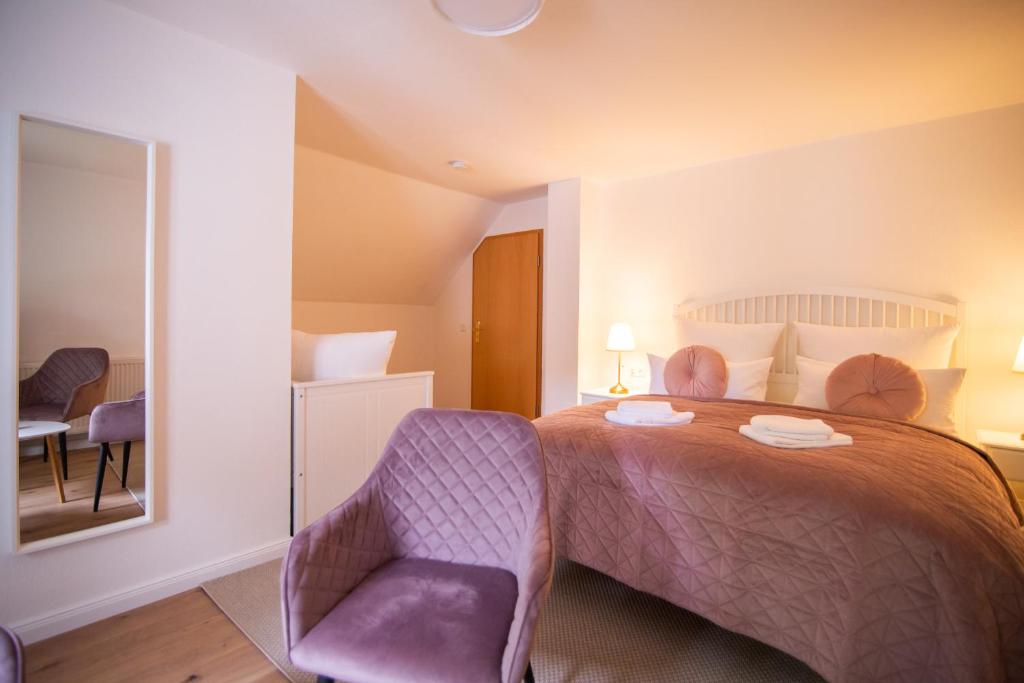 Postel nebo postele na pokoji v ubytování ApartOne Land-Hotel