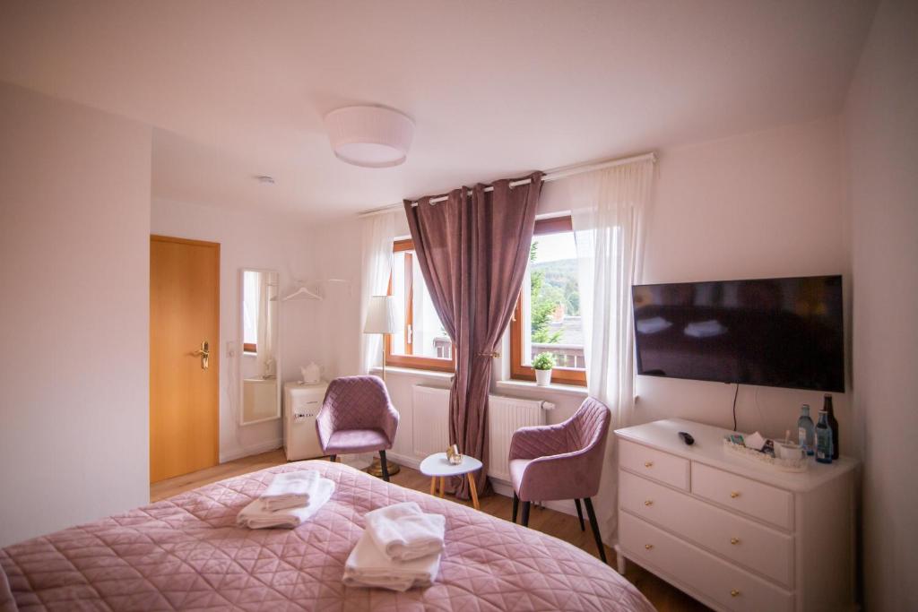 Postel nebo postele na pokoji v ubytování ApartOne Land-Hotel