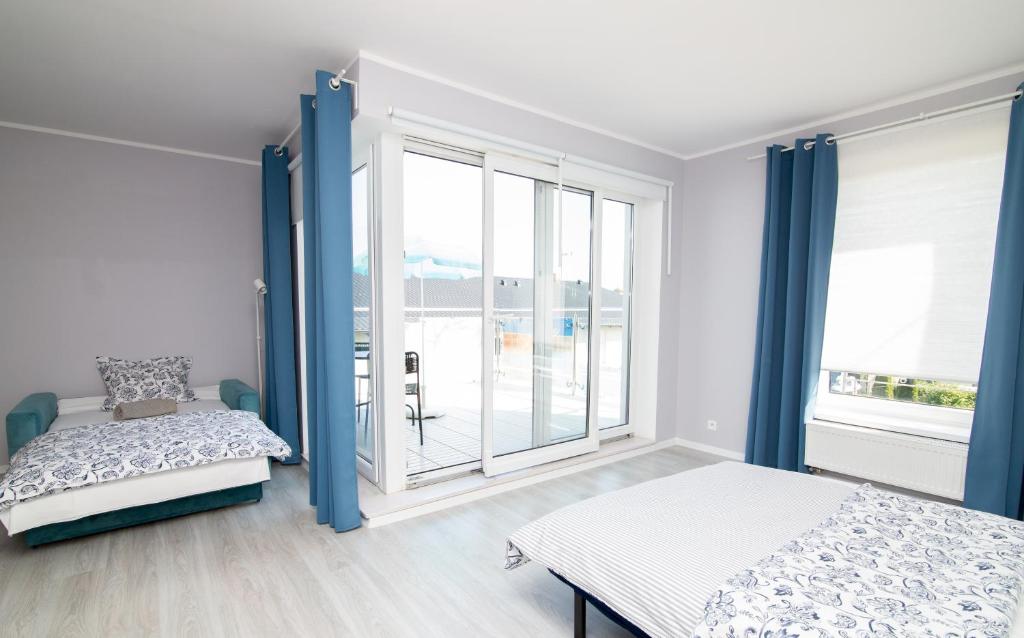 Posteľ alebo postele v izbe v ubytovaní Apartamenty 4YOU Hel