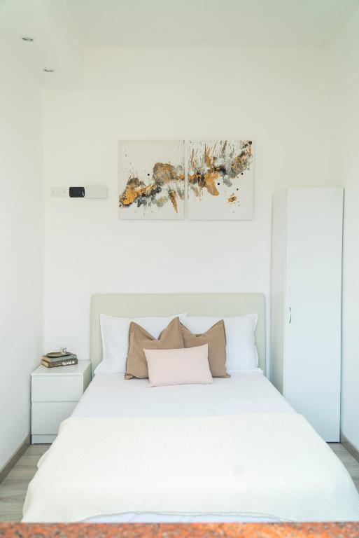 Postel nebo postele na pokoji v ubytování NAGI Lake Como Apartment