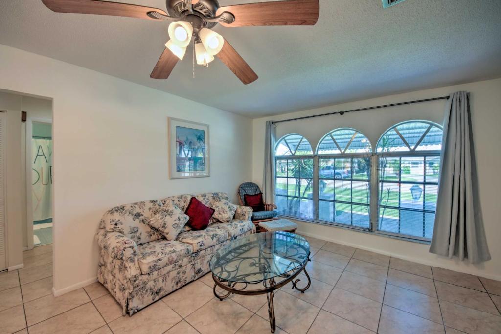 a living room with a couch and a ceiling fan at Port Charlotte Retreat about 4 Mi to Beach Park! in Port Charlotte