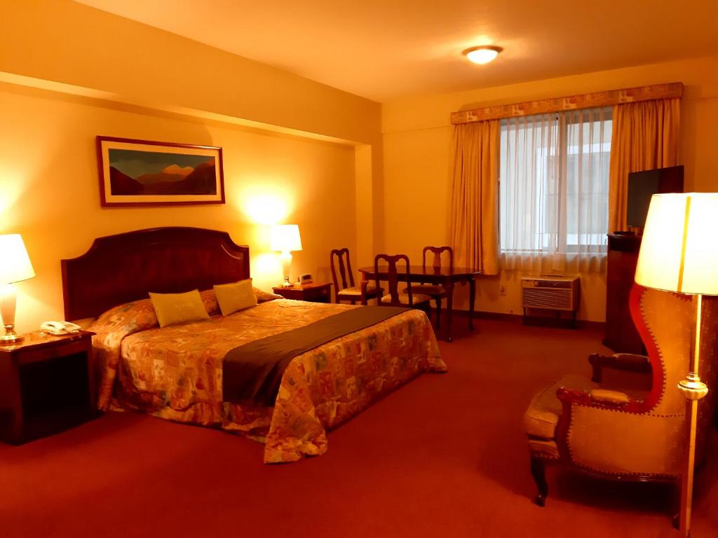 Postel nebo postele na pokoji v ubytování Hotel MAURY