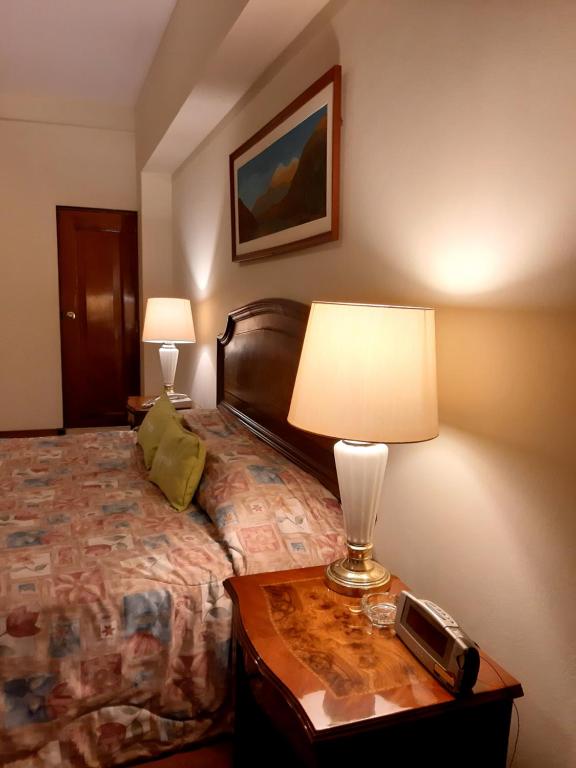 Postel nebo postele na pokoji v ubytování Hotel MAURY