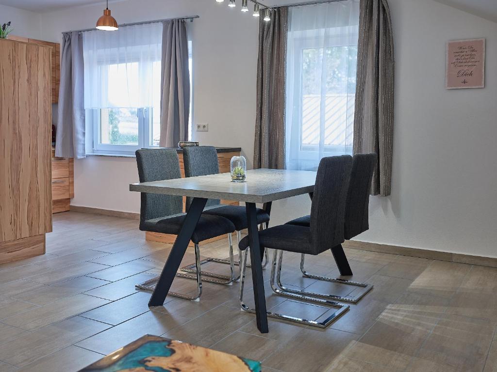 a dining room with a table and chairs at Mayr-Hof (Mank) Appartement in Seimetzbach