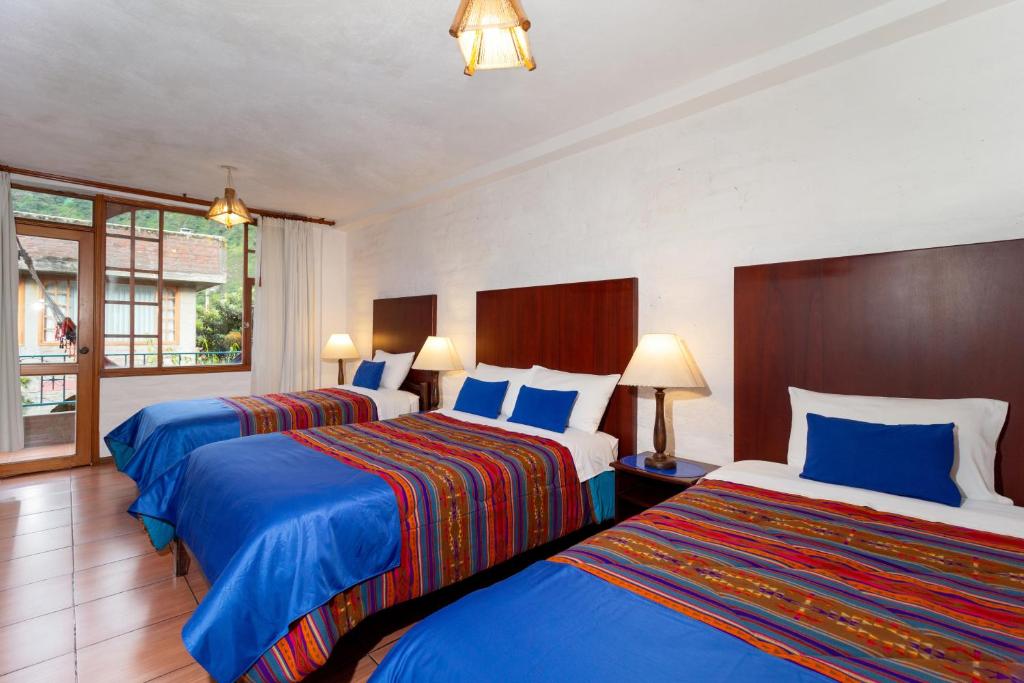 Postel nebo postele na pokoji v ubytování La Floresta Hotel