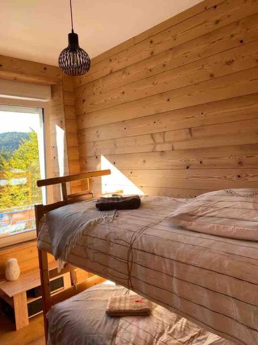 Posteľ alebo postele v izbe v ubytovaní L'apparté de G, Gîte 3 étoiles de montagne cosy