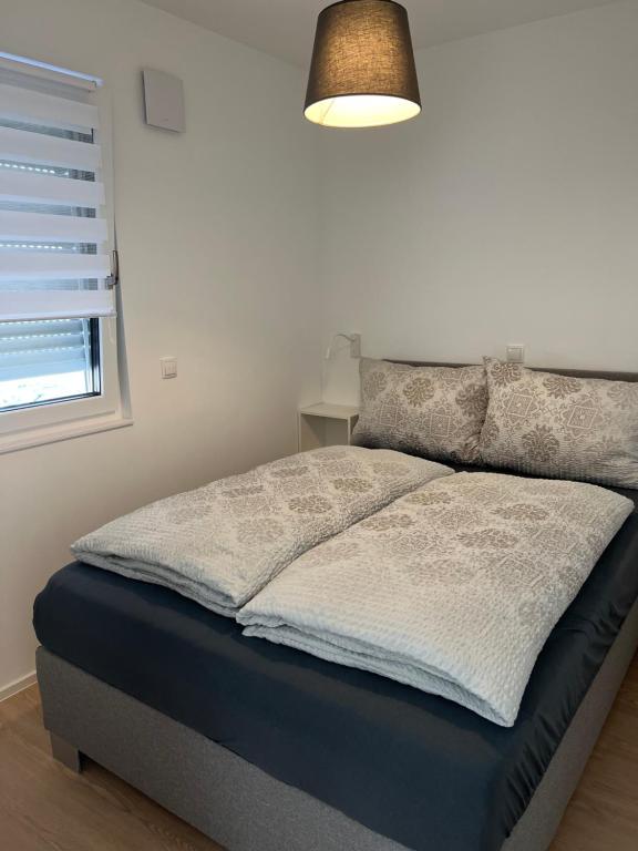Postel nebo postele na pokoji v ubytování Black Forest Apartments