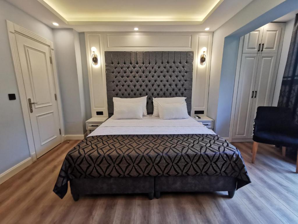 Postel nebo postele na pokoji v ubytování Luxx Garden Hotel