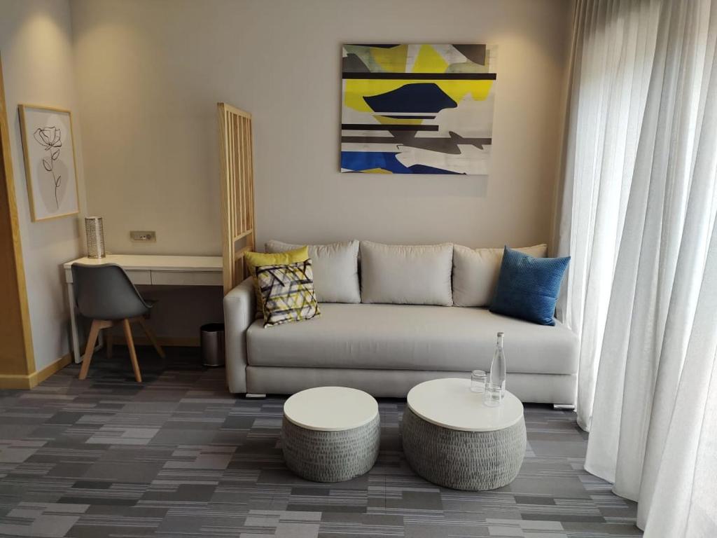 a living room with a couch and a table at Valley Boutique Hotel in Safi