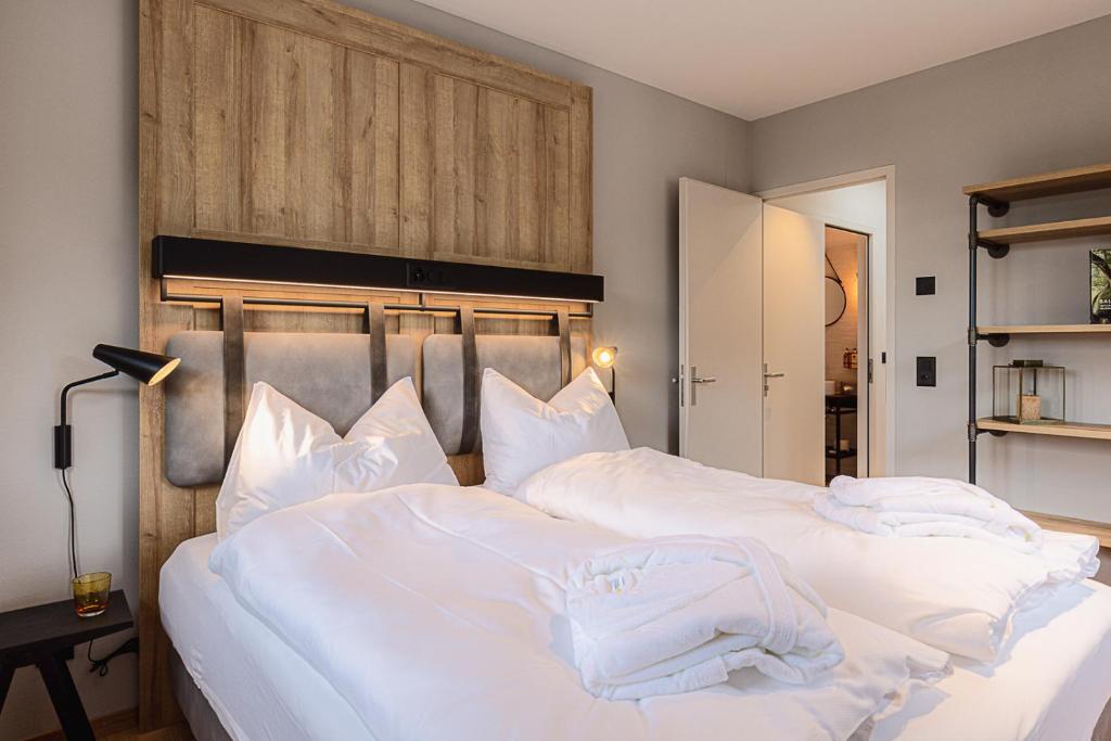 Ein Bett oder Betten in einem Zimmer der Unterkunft ALPINE INN Davos
