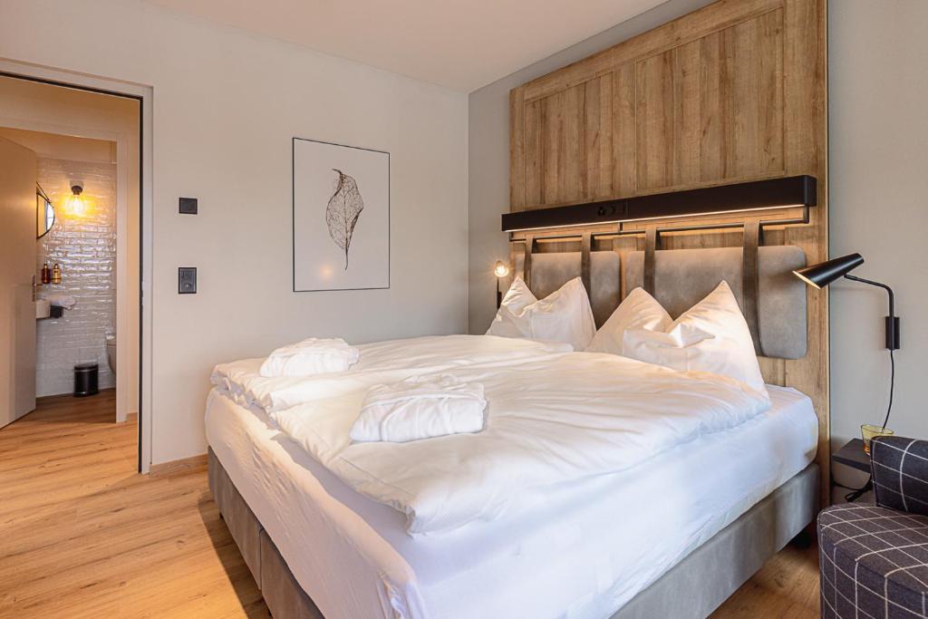 Ein Bett oder Betten in einem Zimmer der Unterkunft ALPINE INN Davos