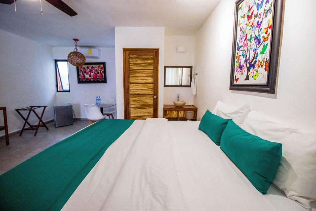 Postel nebo postele na pokoji v ubytování Hotel Tequila Cancun