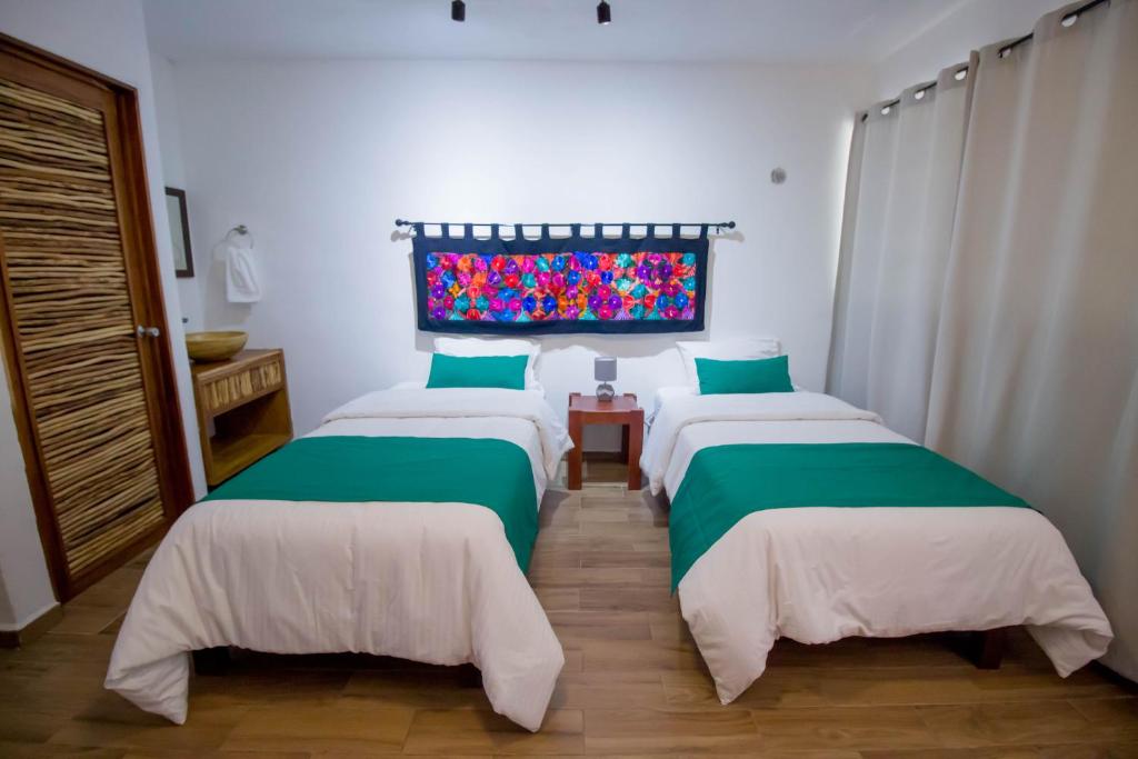 Postel nebo postele na pokoji v ubytování Hotel Tequila Cancun