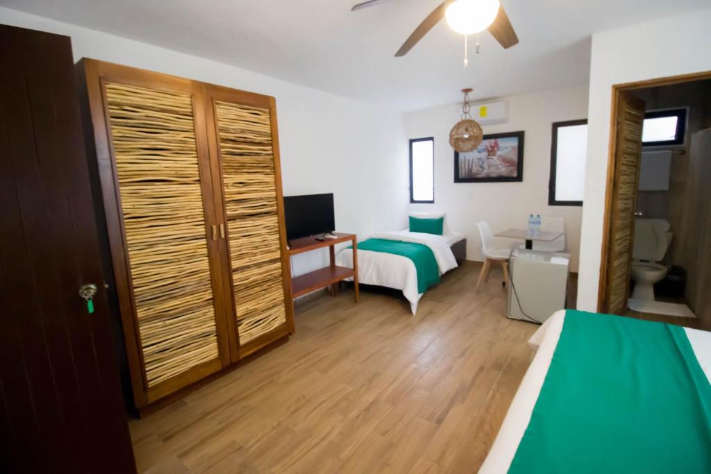 Postel nebo postele na pokoji v ubytování Hotel Tequila Cancun