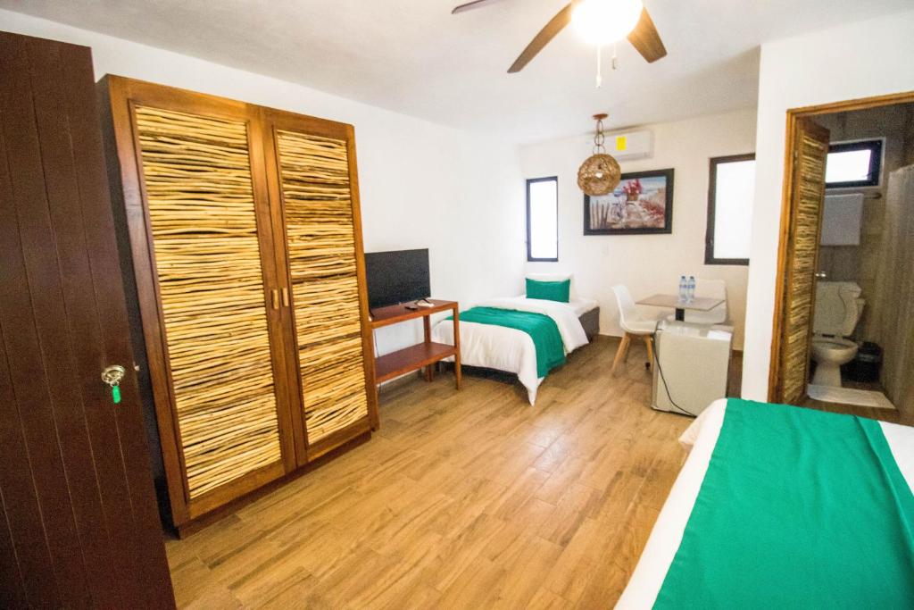 Postel nebo postele na pokoji v ubytování Hotel Tequila Cancun