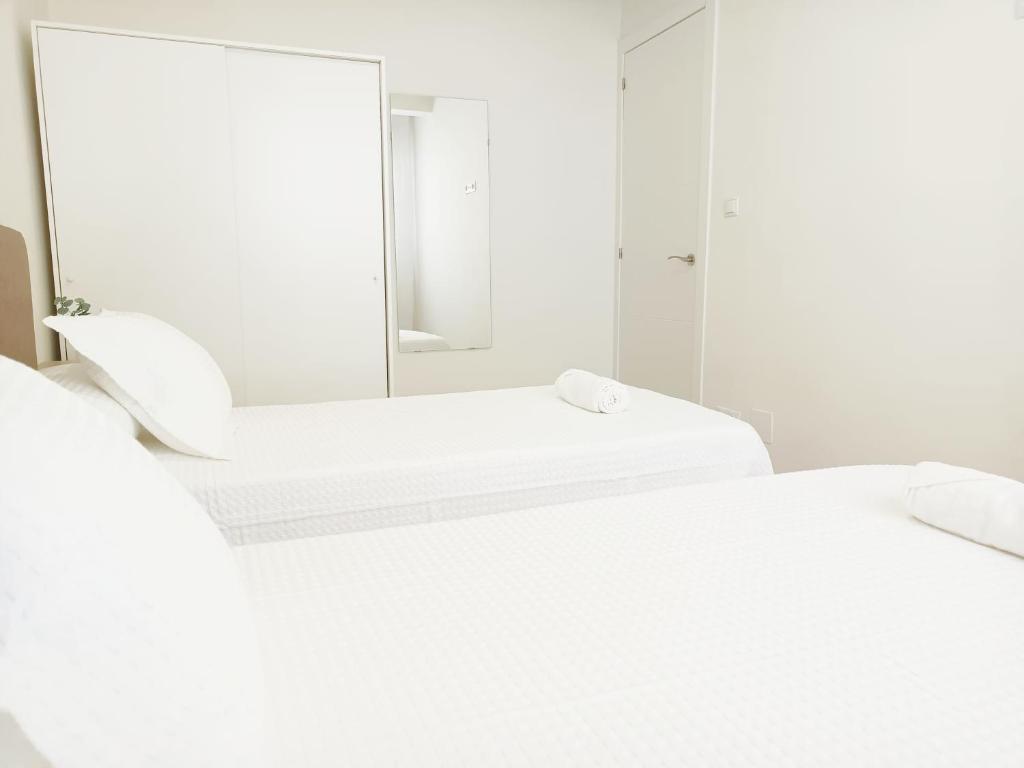 Łóżko lub łóżka w pokoju w obiekcie A Capelada-Céntrico apartamento en Cedeira