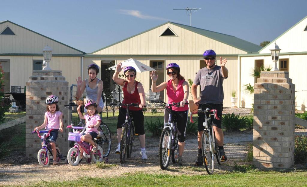 a group of people on their bikes in front of a house at Milawa Muscat Retreat B&B in Milawa