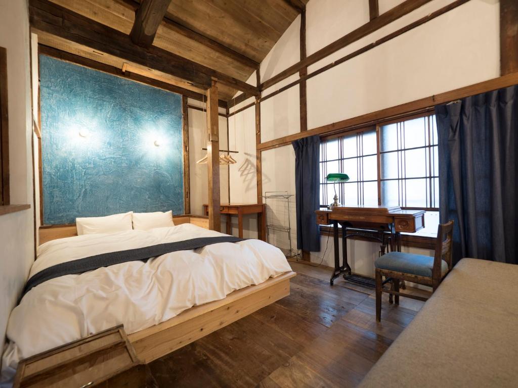 Postel nebo postele na pokoji v ubytování TOKYO LITTLE HOUSE