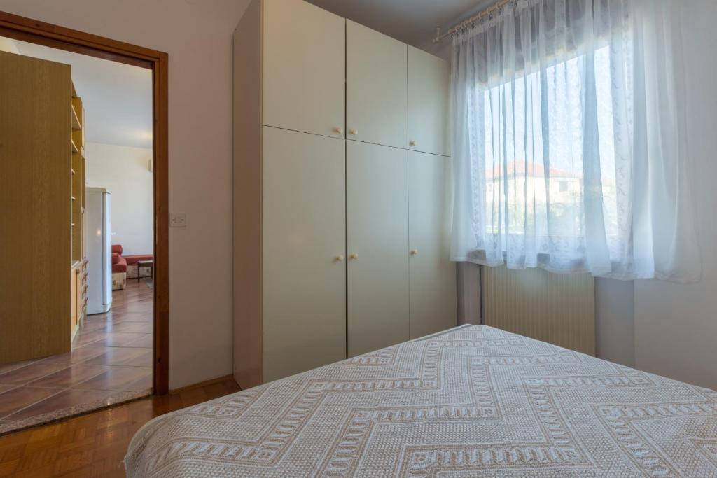 Posteľ alebo postele v izbe v ubytovaní Apartment Umag 6992a