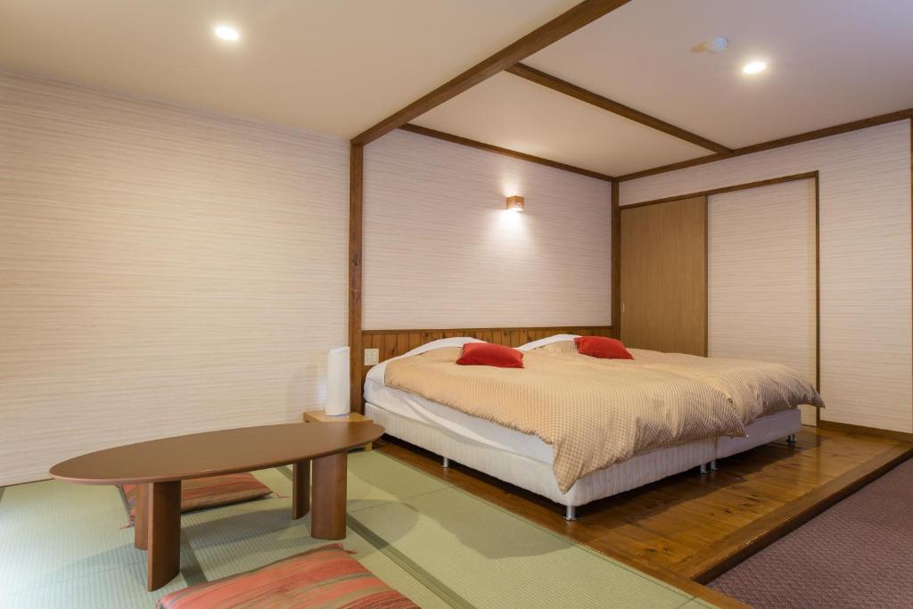 Postel nebo postele na pokoji v ubytování Hotel Goryukan