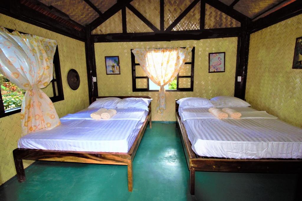 Postel nebo postele na pokoji v ubytování Concepcion Divers Lodge