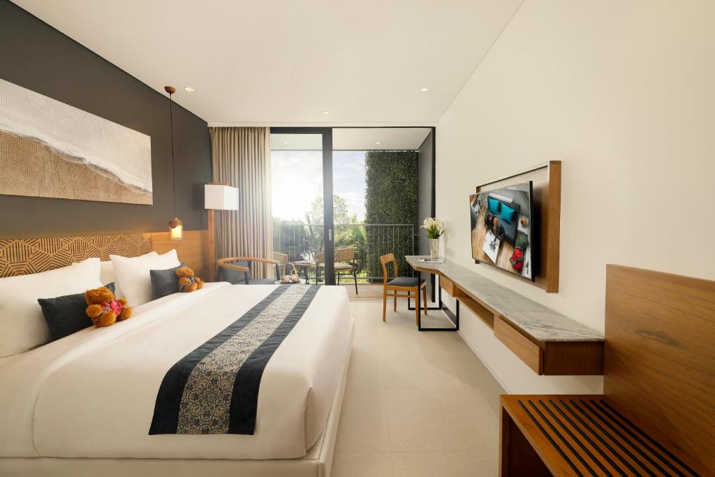 Postel nebo postele na pokoji v ubytování Citadines Berawa Beach Bali