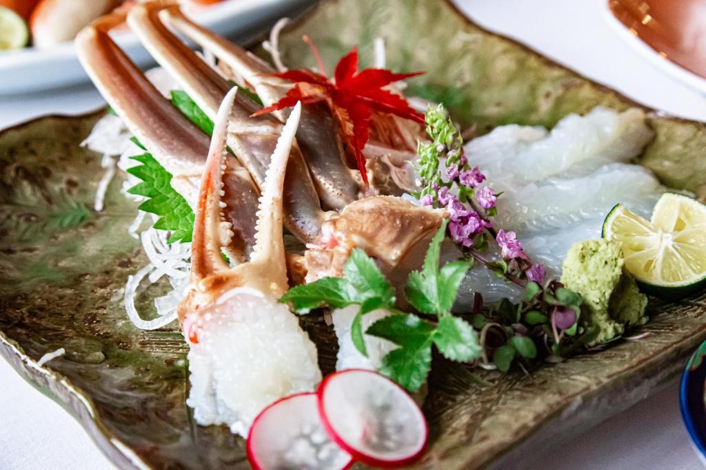 a plate of food with seafood and vegetables on it at 川端屋　kawabataya in Minamiechizen