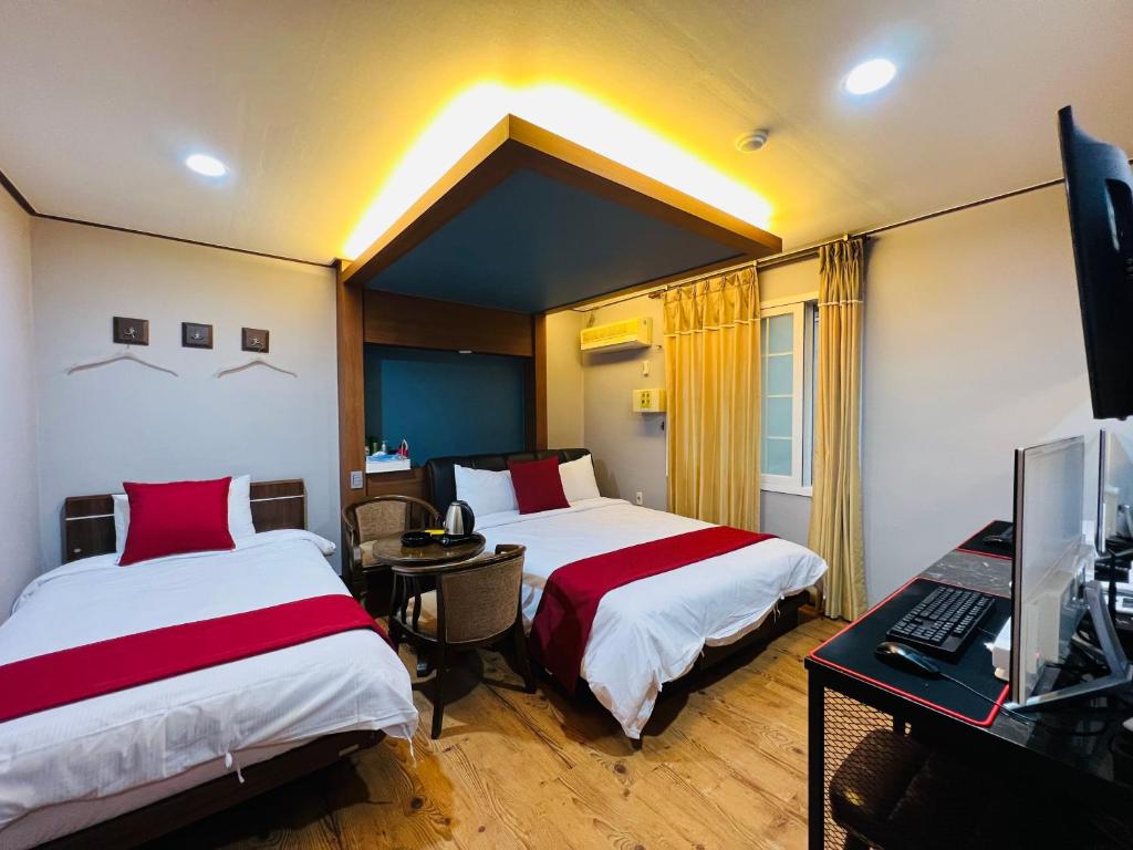 Postel nebo postele na pokoji v ubytování Sweet Hotel