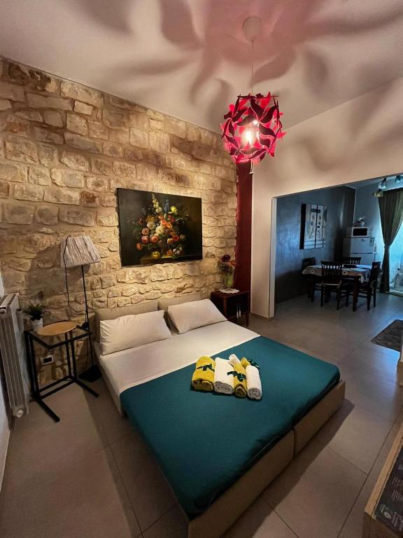 Posteľ alebo postele v izbe v ubytovaní Casa Vacanze Le Giuseppine