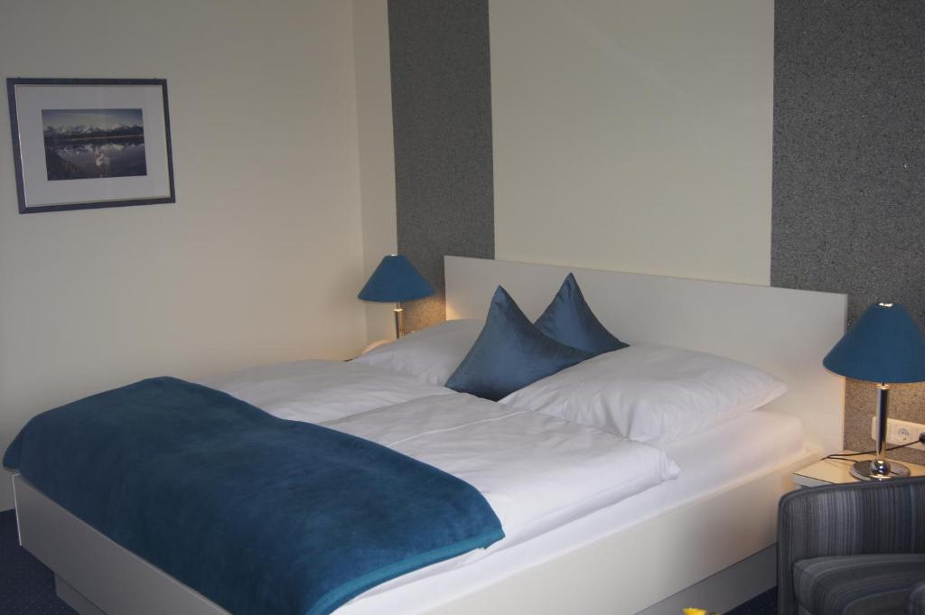 Postel nebo postele na pokoji v ubytování Hotel Christine