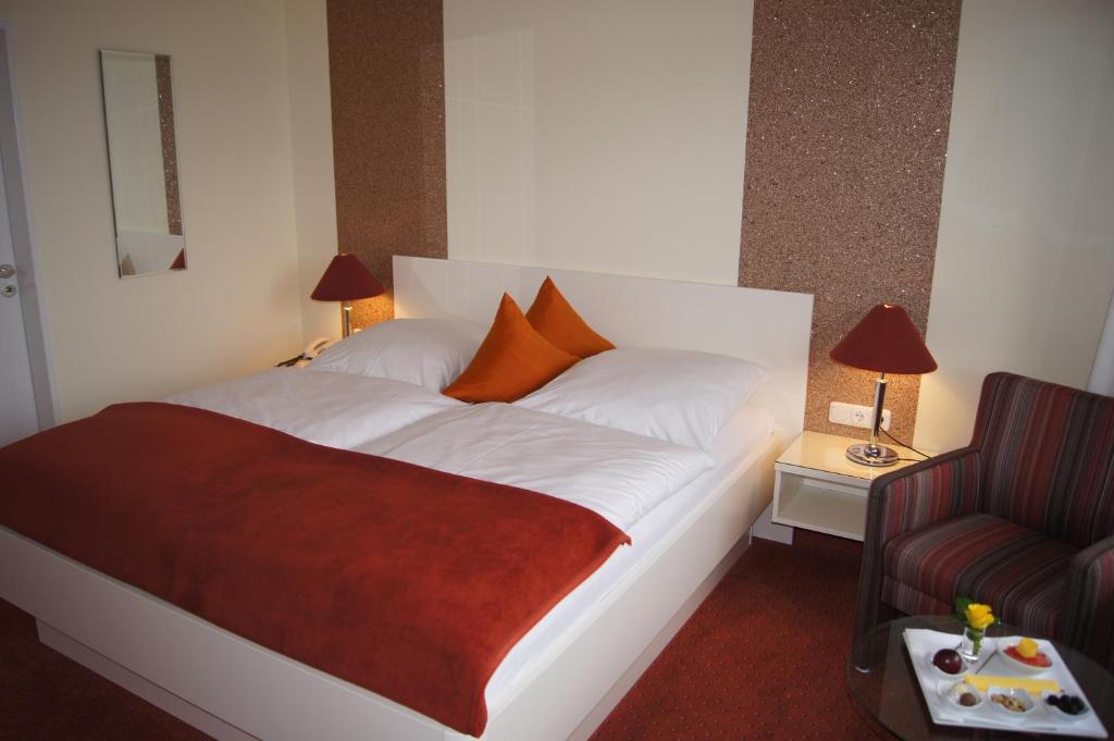 Postel nebo postele na pokoji v ubytování Hotel Christine