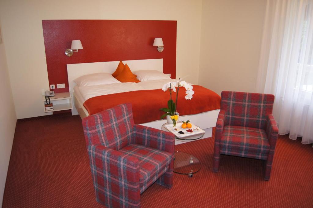 Postel nebo postele na pokoji v ubytování Hotel Christine