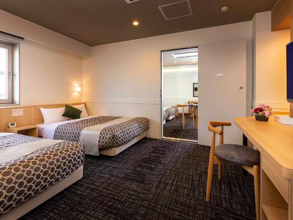 Krevet ili kreveti u jedinici u okviru objekta Tokai City Hotel